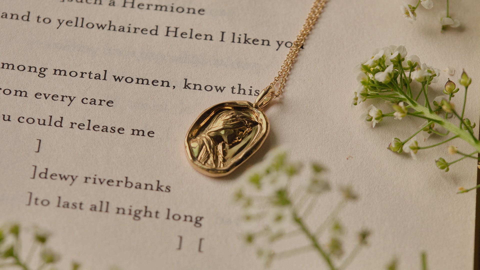 sappho necklace on book