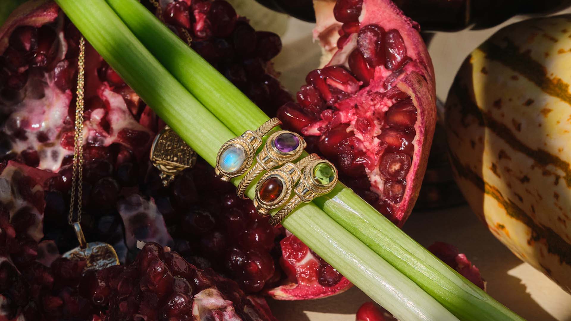 four ancient heirloom gemstone rings in a still life