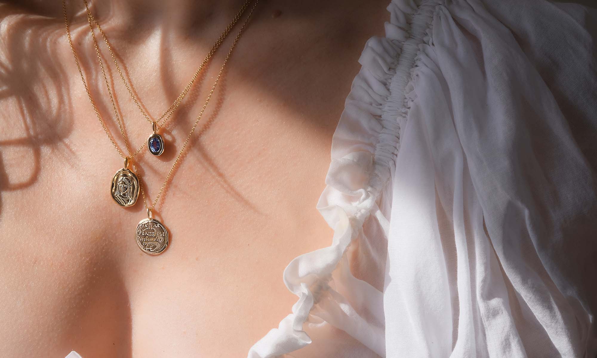 three mythology necklaces stacked from common era jewelry goddess and zodiac collections